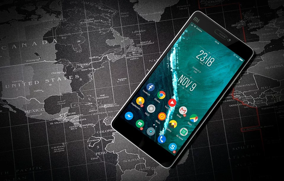 Smartphone lies on a map of the world